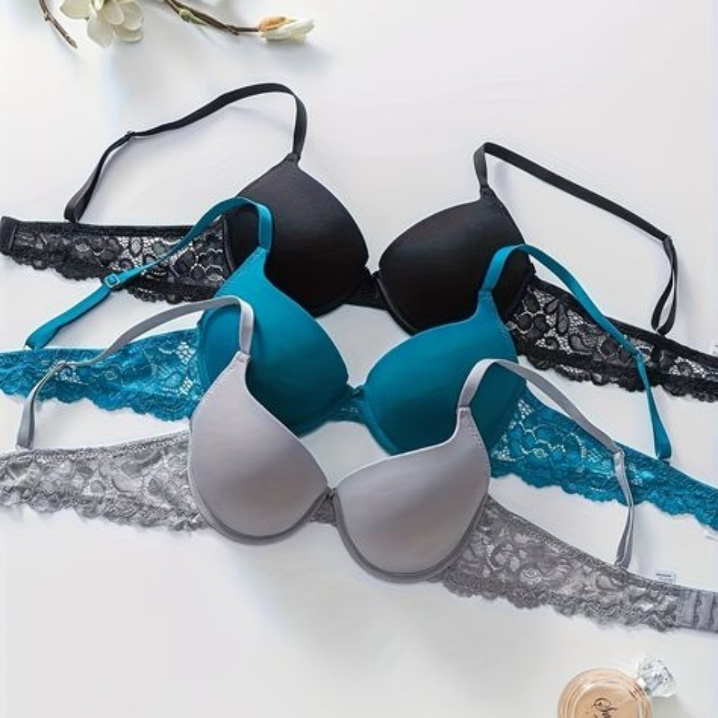 A selection of colorful bras displayed on a light surface, including black, teal, and gray options, with lace detailing.
smart sports wear
