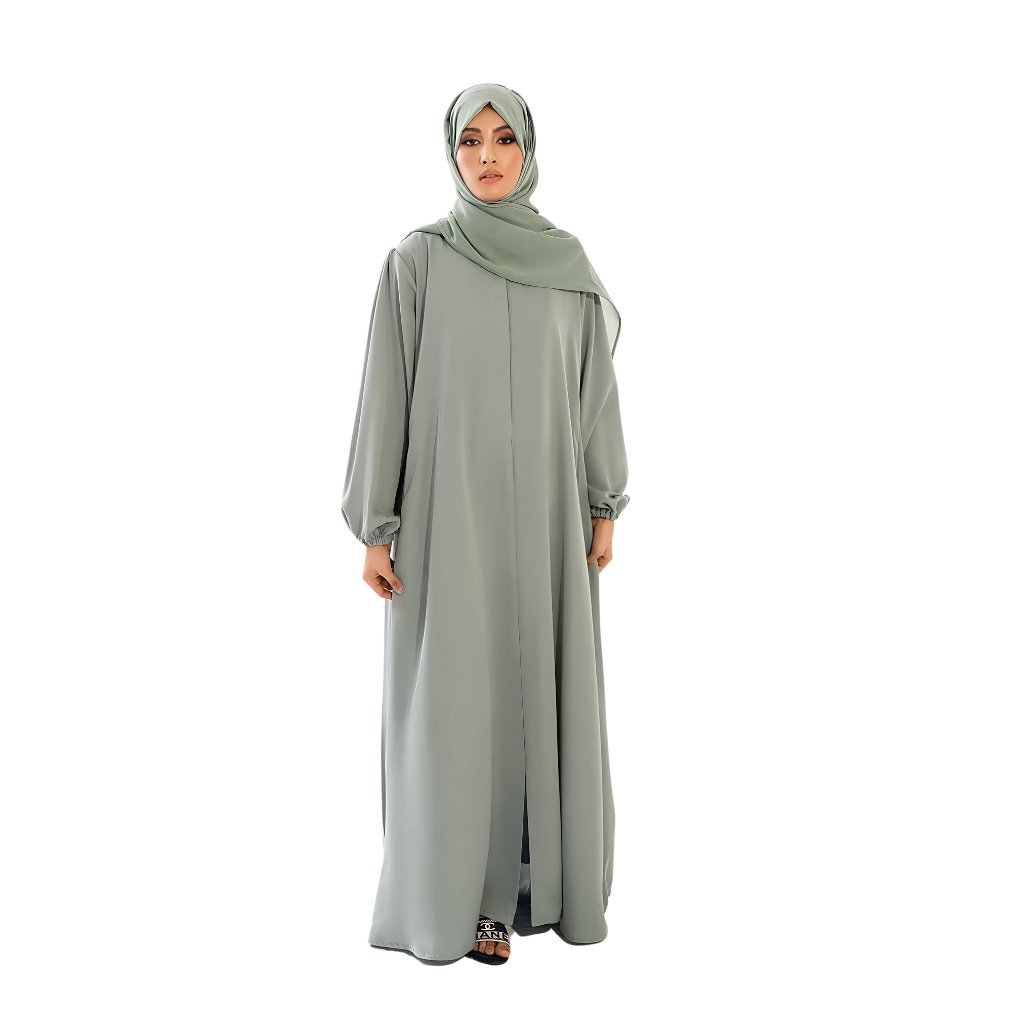 An open-front abaya elegantly draped over a mannequin, showcasing its flowing silhouette, soft fabric, and simple, chic design.