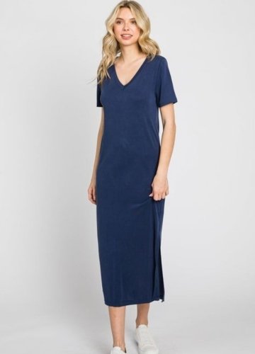 Model wearing a navy blue tee dress with short sleeves and a side slit.