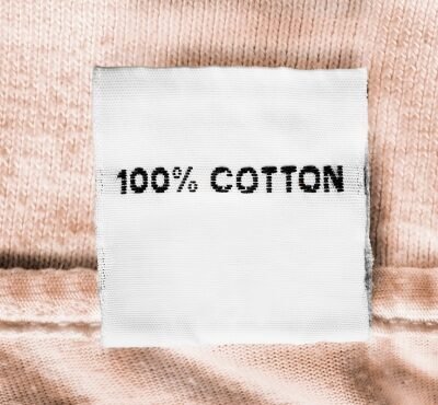 Label showing "100% COTTON" on a garment.