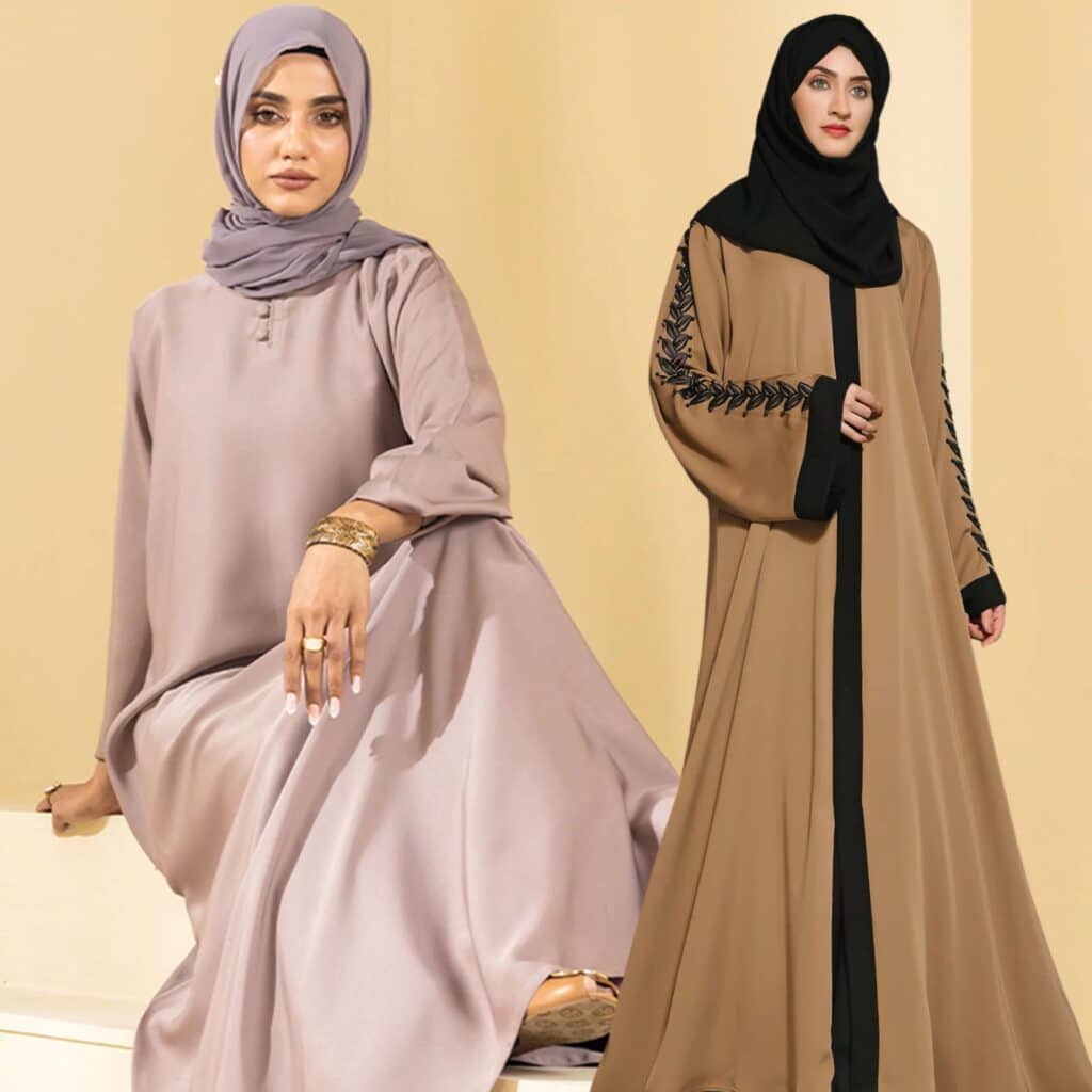 Two women wearing stylish hijabs and abayas. The woman on the left is seated in a light gray abaya and matching hijab, showcasing a gold bracelet and ring. The woman on the right stands in a brown abaya with black detailing and a black hijab, displaying elegant embroidery.