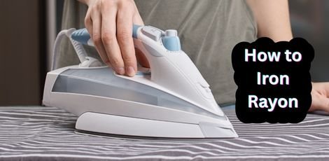 Person using a steam iron on a rayon fabric. " how to iron rayon"