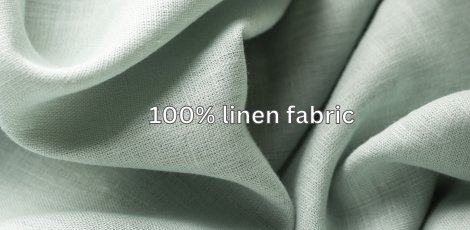 Close-up of a soft, green linen fabric with wrinkled texture.