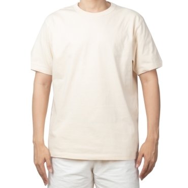 A person wearing a cream-colored t-shirt stands with arms slightly outstretched against a plain white background.