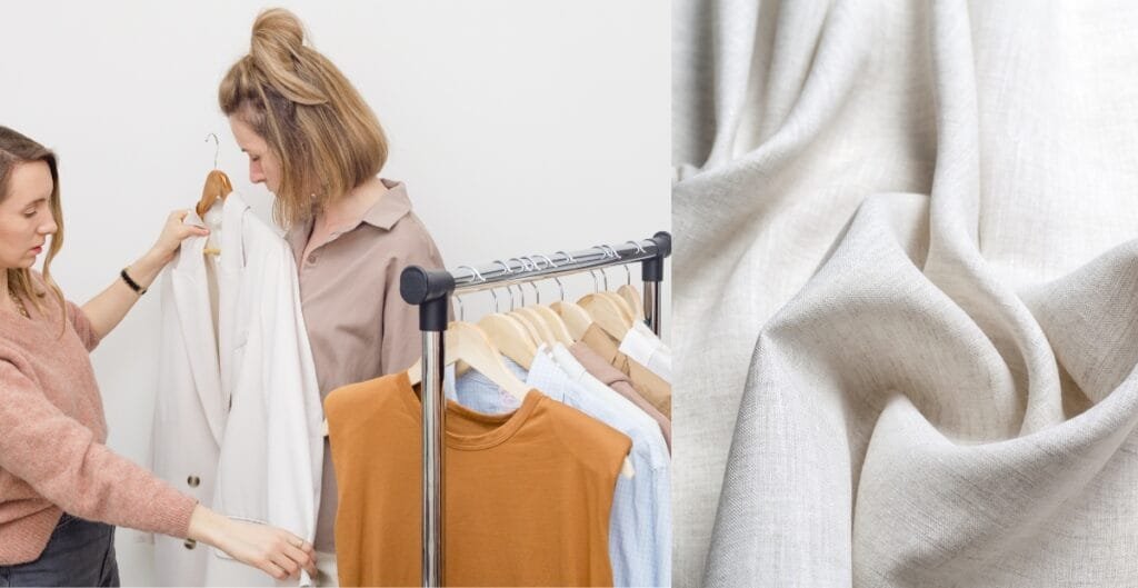Two women selecting a white linen blazer from a clothing rack with various garments and linen fabric.