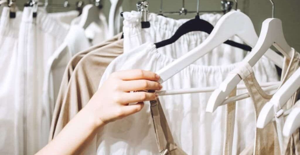 Alt text template: Describe the visual content clearly and succinctly, including the key message about sustainability and 100% cotton.