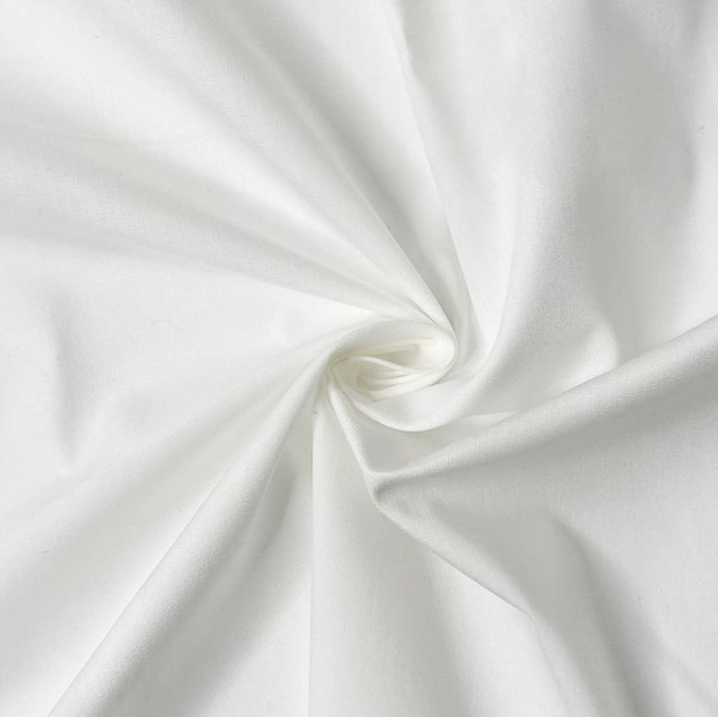 A close-up image of smooth, white cotton fabric arranged in a soft, swirling pattern, showcasing its silky texture.