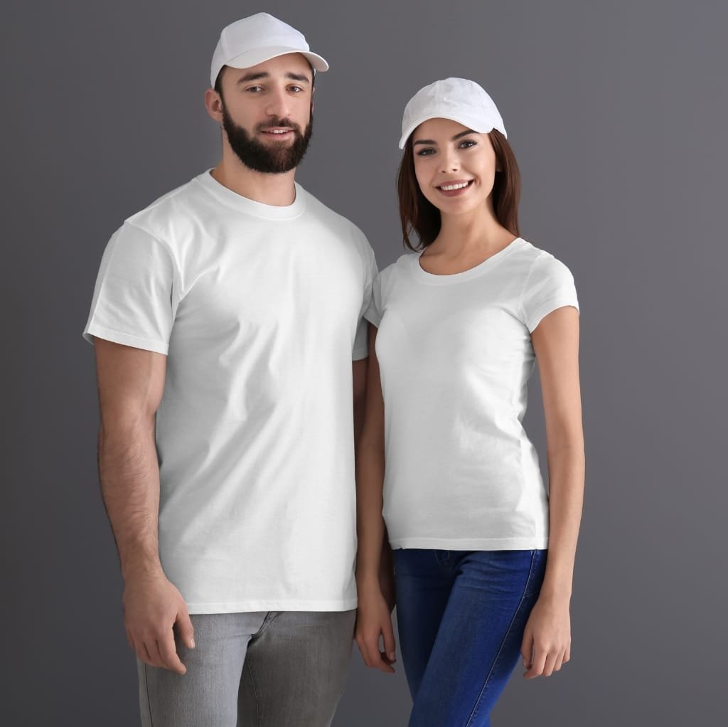 Two young adults, a man and a woman, standing side by side in casual fall fashion, wearing white t-shirts and white caps against a grey background. 