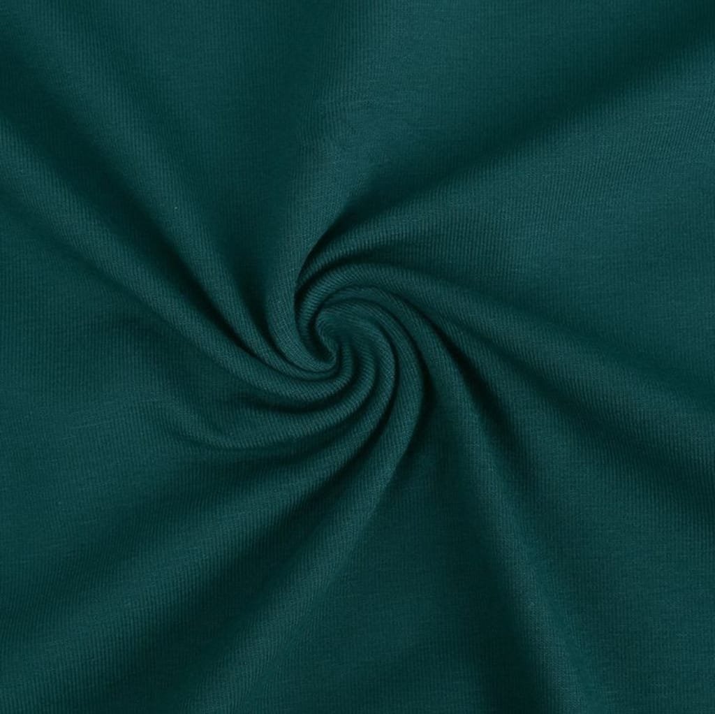 A close-up image of teal jersey cotton fabric twisted into a swirl, showcasing its smooth, stretchy texture. 