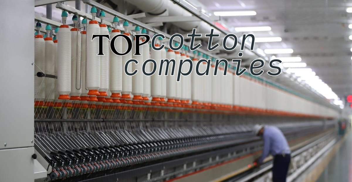 An industrial textile manufacturing environment with yarn spindles and a worker operating machinery, overlaid with the text "Top Cotton Companies."