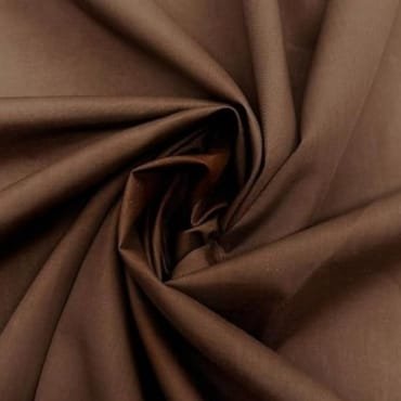 A close-up image of brown fabric twisted in a spiral, showcasing its smooth texture.