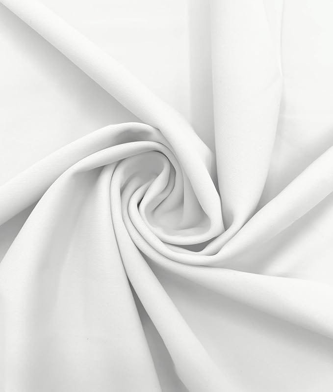 Close-up of smooth white fabric arranged in a spiral fold pattern.