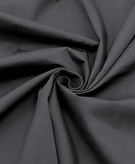 Close-up of black cotton fabric with a smooth texture, arranged in a spiral fold.