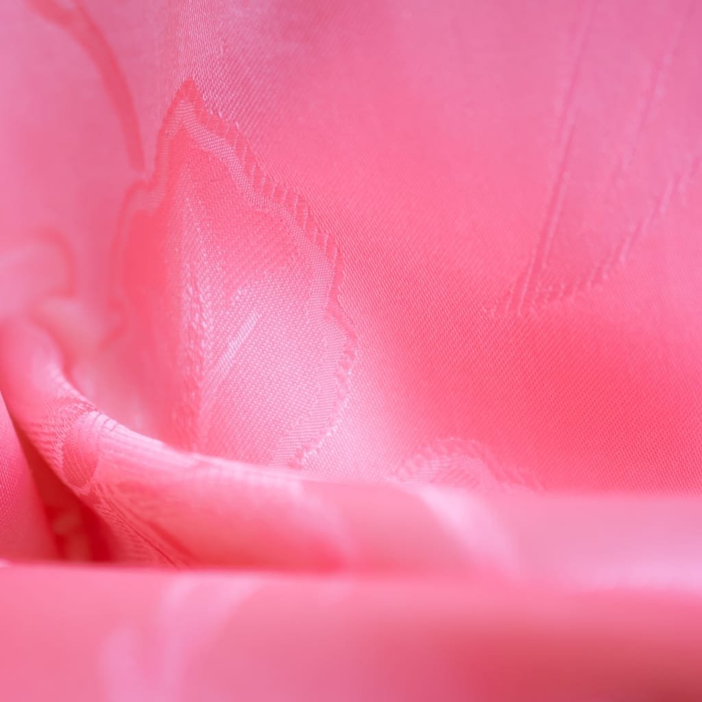 Close-up image of pink nylon organza fabric showing its delicate and sheer texture.