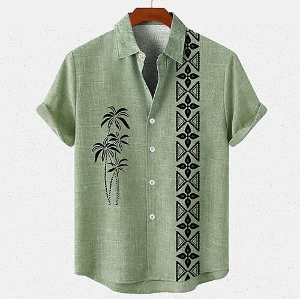 A light green men's beach shirt with short sleeves, featuring a black palm tree design on the left chest area and a vertical geometric pattern along the right front side. The shirt is displayed against a plain background on a wooden hanger.
