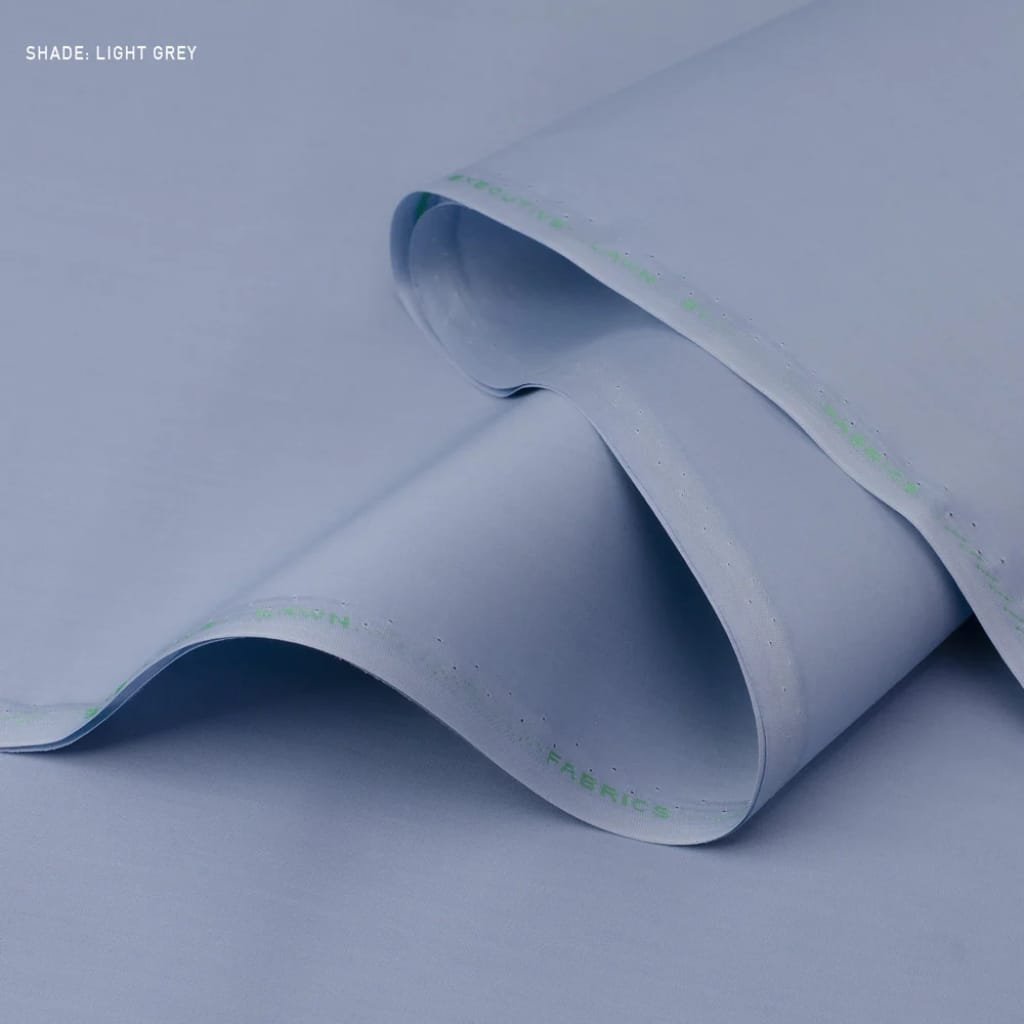 A close-up of light grey fabric with a smooth, slightly folded texture.