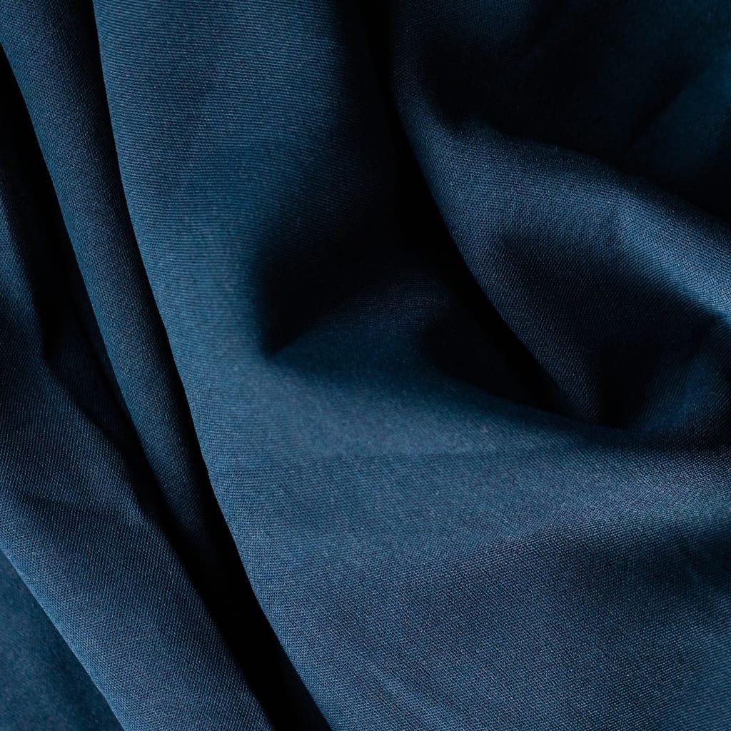 A close-up image of soft, high-quality Pima cotton fabric showcasing its smooth texture and luxurious appearance.