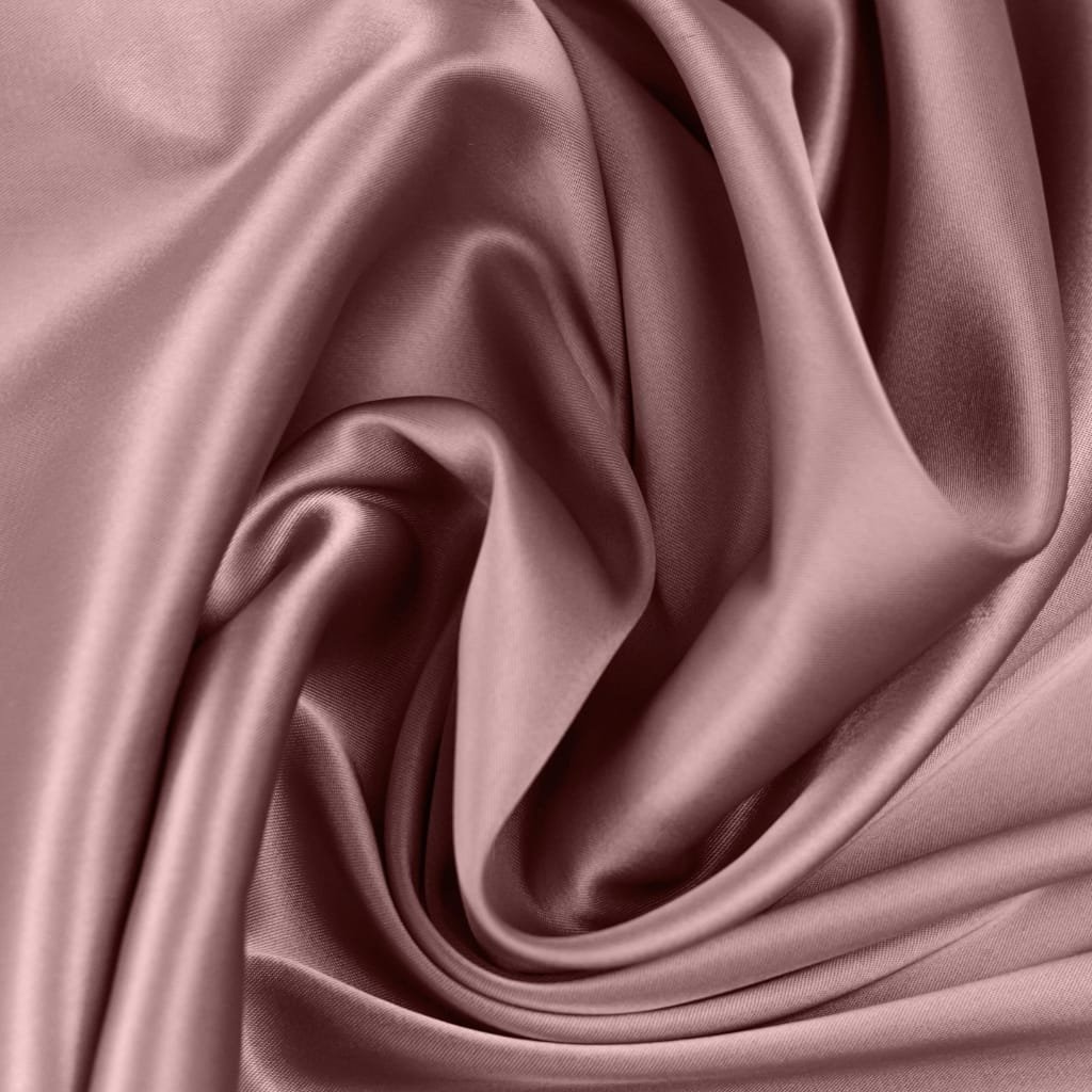Close-up image of soft, shiny, pink satin chiffon fabric with smooth, flowing folds.