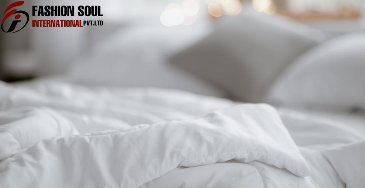 A neatly made bed with white pillows and bedding, with a blurred background and a logo in the upper left corner reading "Fashion Soul International Pvt. Ltd."