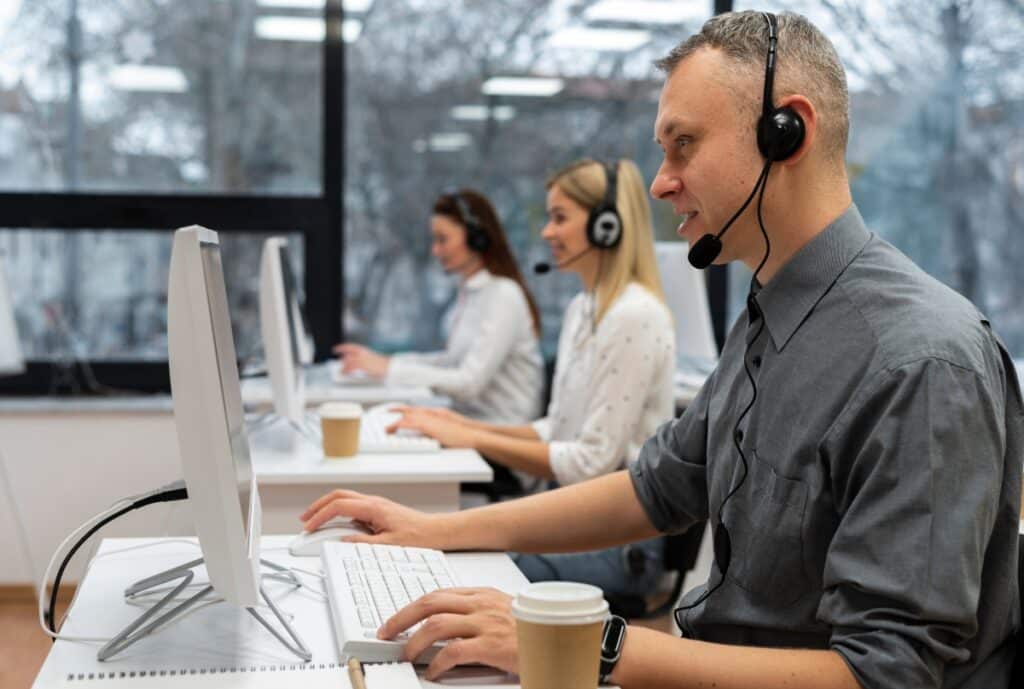 A customer service representative assisting a client via phone with after-sales support, alongside a visual of a reordering process on a computer screen.