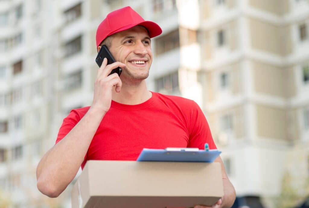 Customer service representative assists a happy customer with post-delivery support via phone, with options for quick reordering displayed on a digital device.
