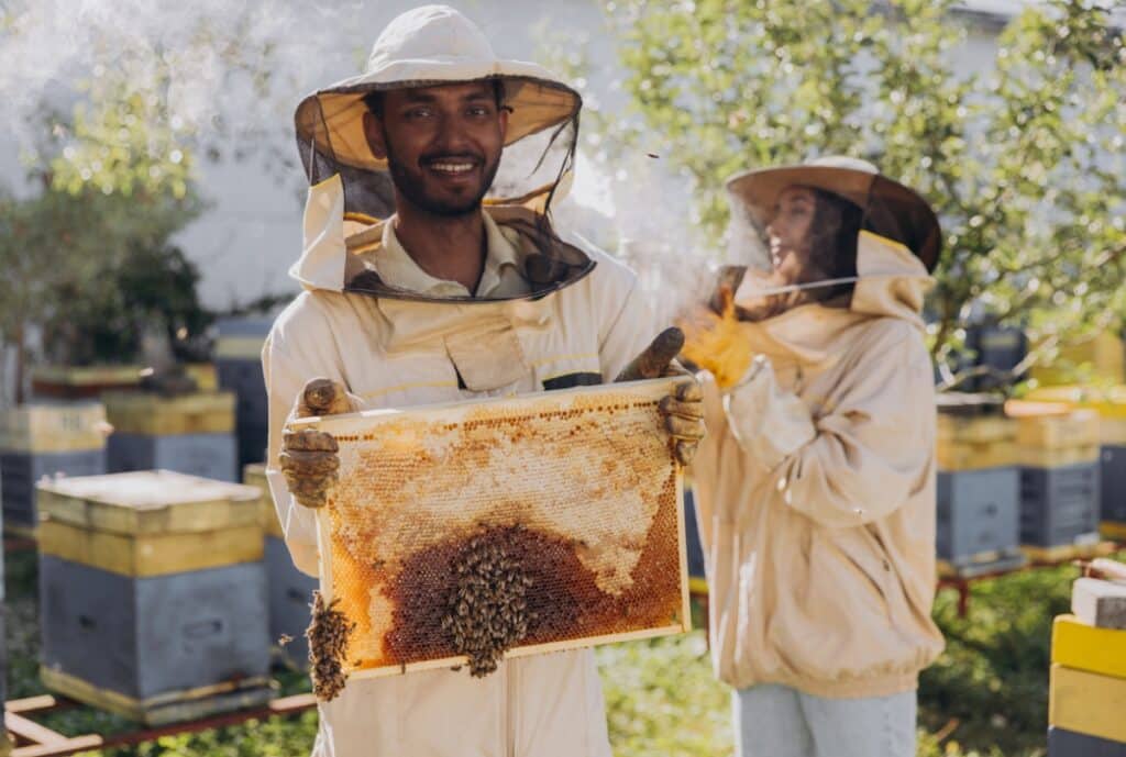 Collage of smiling beekeepers holding harvest with framed written testimonials overlay.