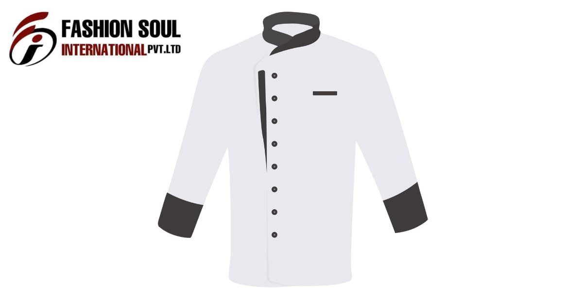 A simple illustration of a white chef’s jacket with black accents. The jacket has a double-breasted row of black buttons on the left, a black trim along one side, a small black pocket at the chest, black cuffs, and a dark gray collar.