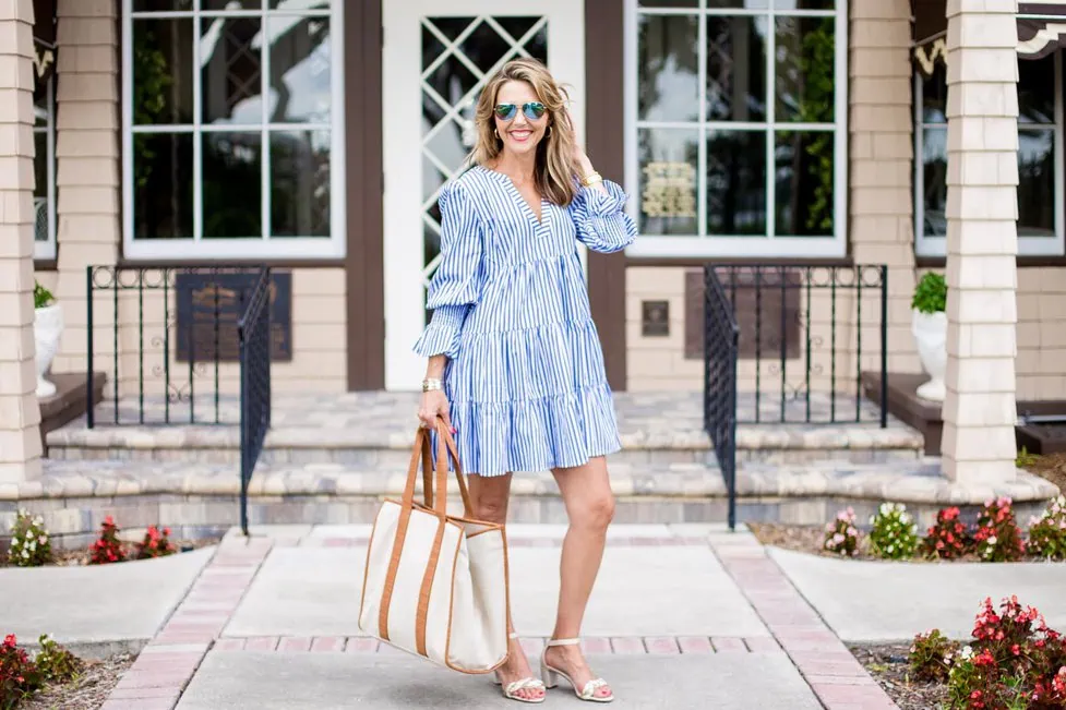 Woman wearing a cotton casual midi dress outdoors, showing a comfortable and fashionable outfit for daily wear.