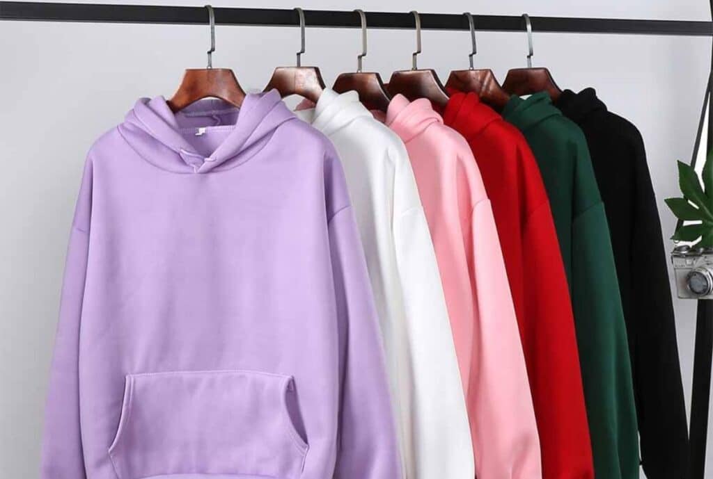 A cozy, oversized hoodie displayed on a hanger with soft fabric texture and a neutral backdrop, suggesting a high-quality, comfortable choice from a top supplier.