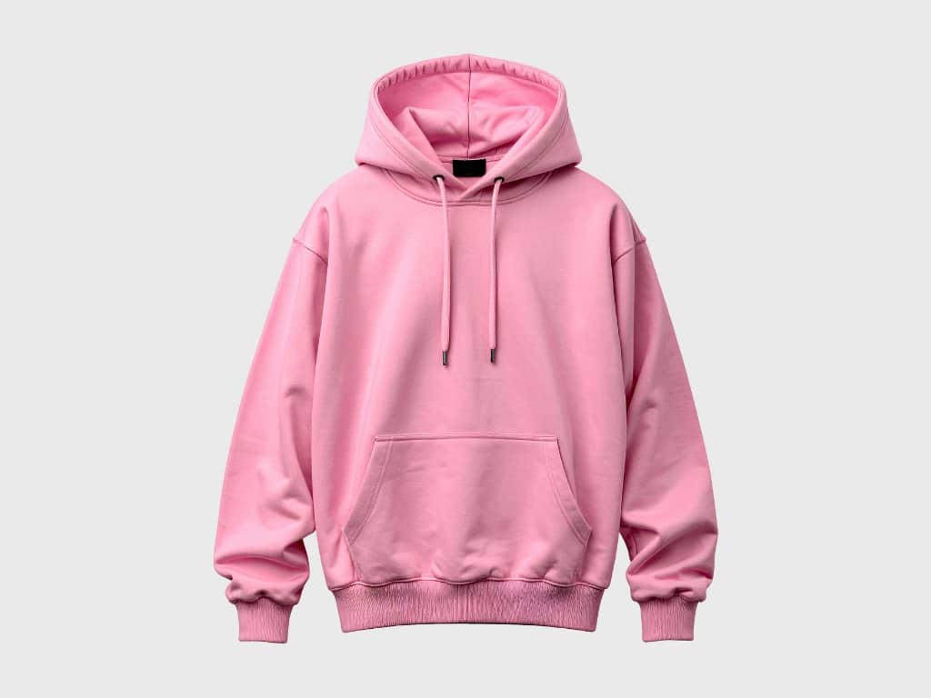 A solid pink hoodie with a front pocket, drawstrings, and ribbed cuffs and hem displayed on a light gray background.