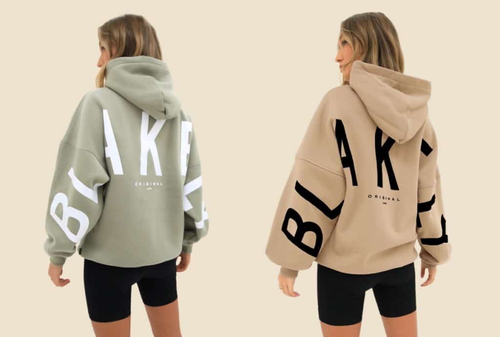 A model wearing a chunky oversized hoodie in a modern Italian street, with a focus on the relaxed fit and soft fabric.