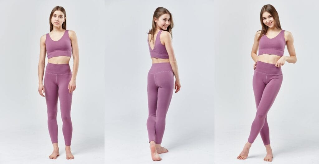 A woman posing in a full-body shot wearing purple gym leggings for ladies, showcasing the leggings' fit and design