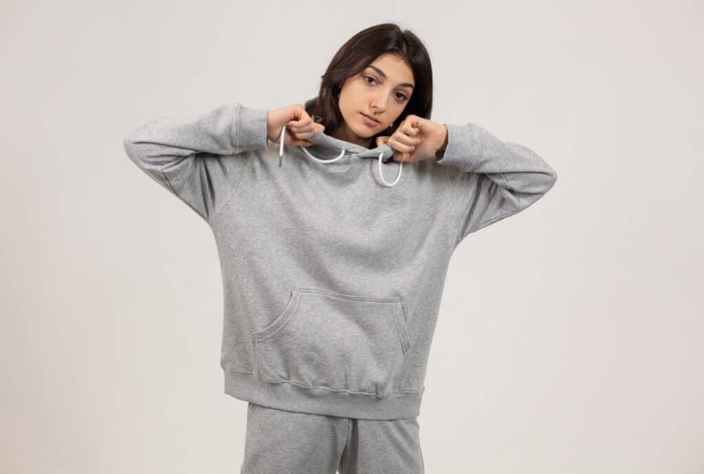 "A diverse display of hoodie styles arranged on racks, showcasing a wide range of colors and fits."