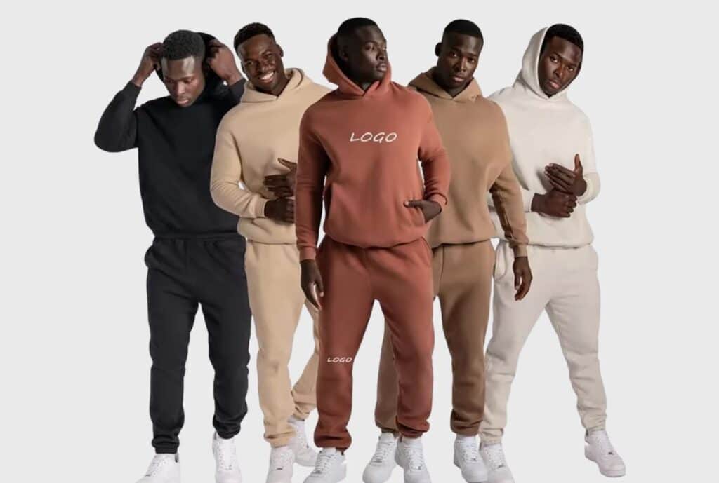 A high-quality French terry sweatsuit set in charcoal gray on a clean white background, featuring a zip hoodie and jogger pants.