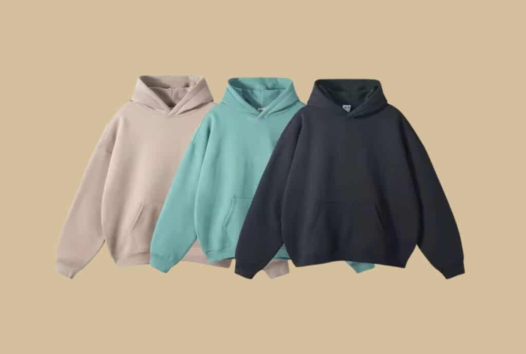 Close-up of an oversized hoodie hanging on a minimalist rack, highlighting the roomy silhouette, soft fabric, and casual drape.