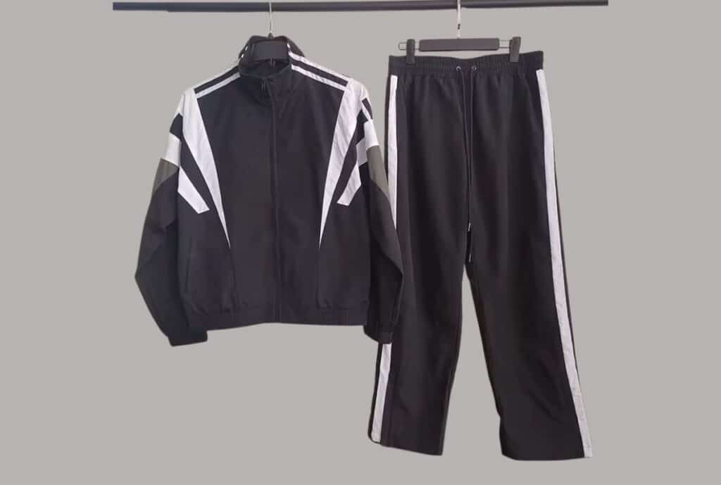 “Rack of colorful tracksuits on display at a USA-based supplier.”
