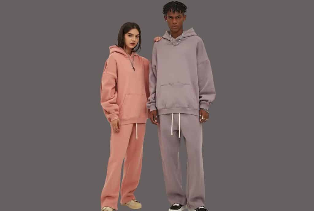 A logistics worker scanning a barcode on a sweatsuit package at a U.S. fulfillment facility.