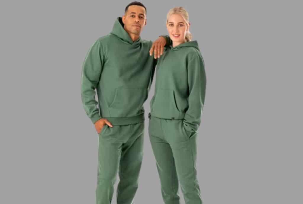 If you want shorter: “Stacks of bulk sweatsuits in a warehouse.”