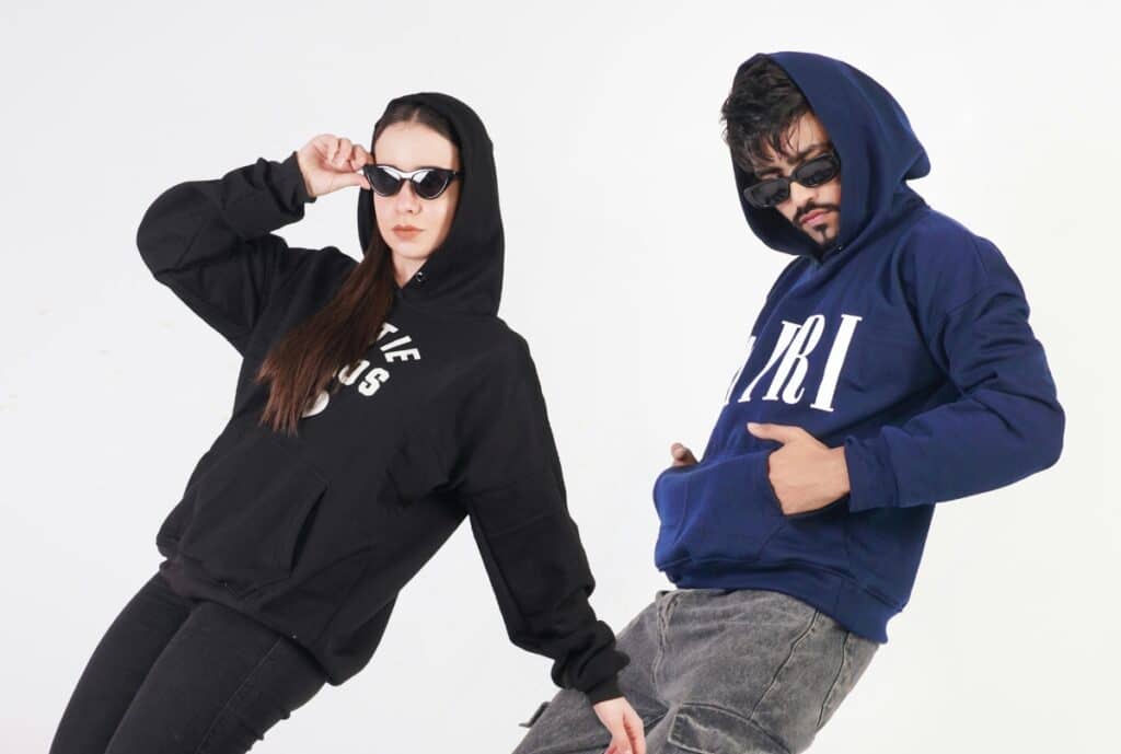 "Premium hoodie displayed on a mannequin in a Manchester factory setting."