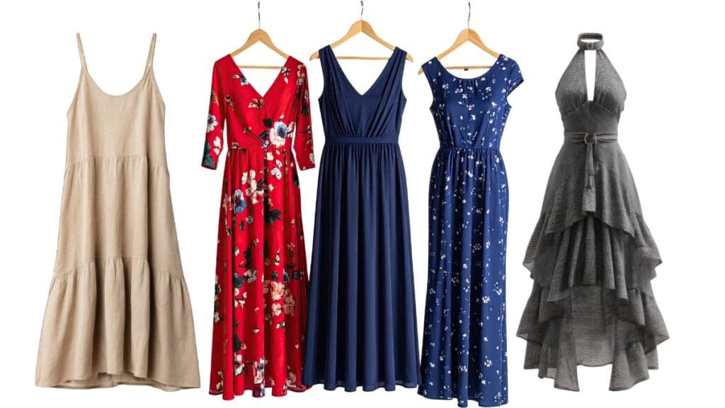 A collection of tiered dress midi styles hanging on wooden hangers in various colors and designs