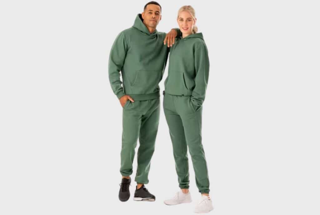 A close-up of a stack of matching sweatsuits with tag displaying ‘Los Angeles bulk order available’.