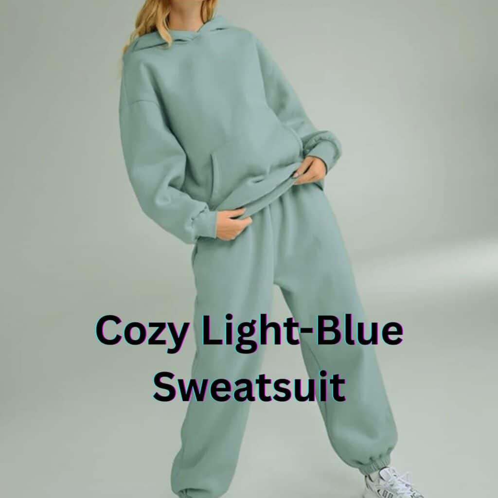 A woman wearing a cozy light-blue hoodie and matching sweatpants, posing in a relaxed and comfortable setting, showcasing a casual yet stylish sweatsuit look.