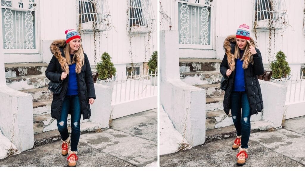 A woman in a black hooded winter coat, blue sweater, and red sneakers, walking outdoors in a snowy setting.