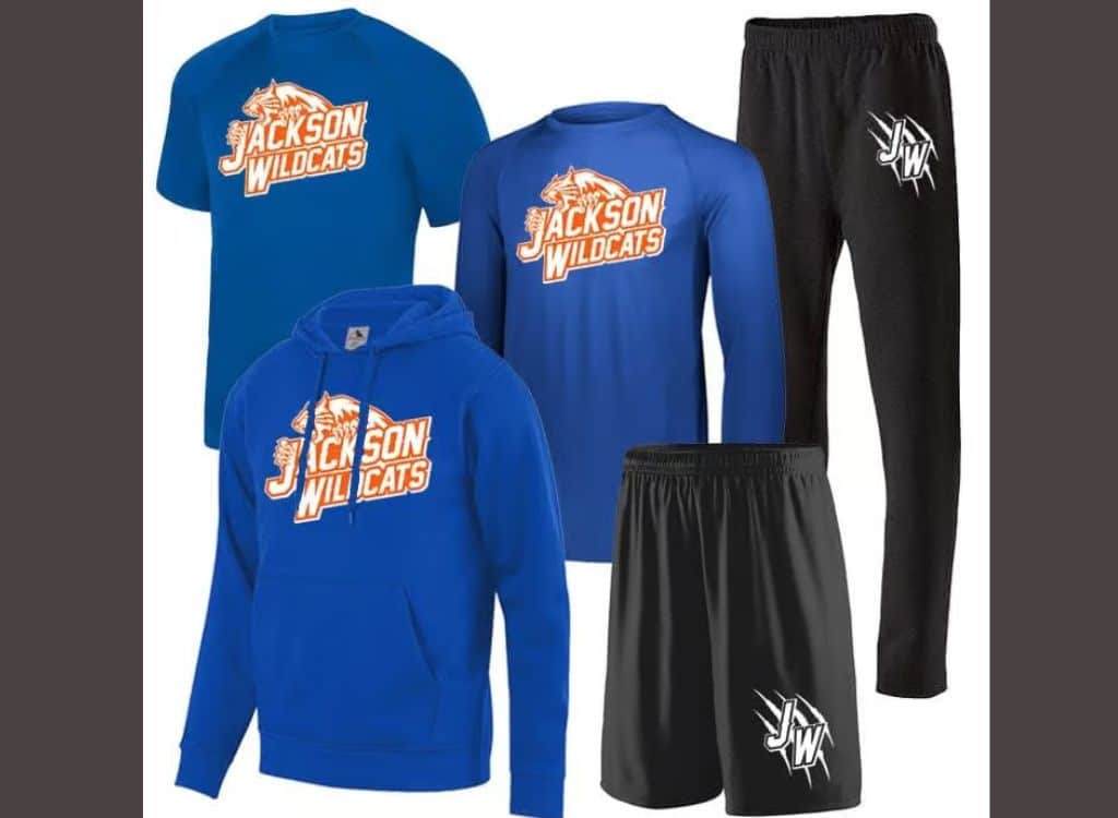 Blue Jackson Wildcats t-shirt, blue long-sleeve shirt, blue hoodie with Jackson Wildcats logo, and black athletic shorts and pants with white logo.