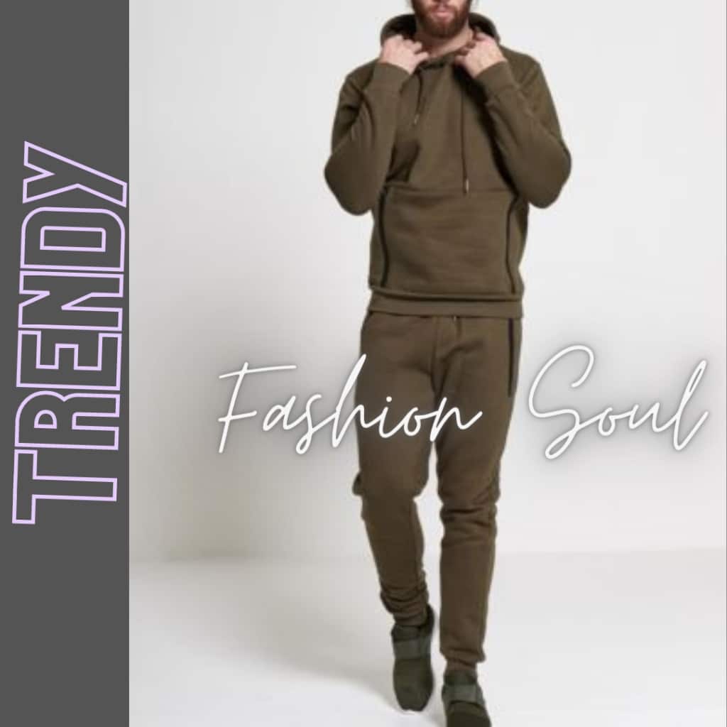 A man dressed in an all-brown athleisure outfit walks toward the camera with a hoodie on, against a light backdrop and bold text reading "Fashion Soul."