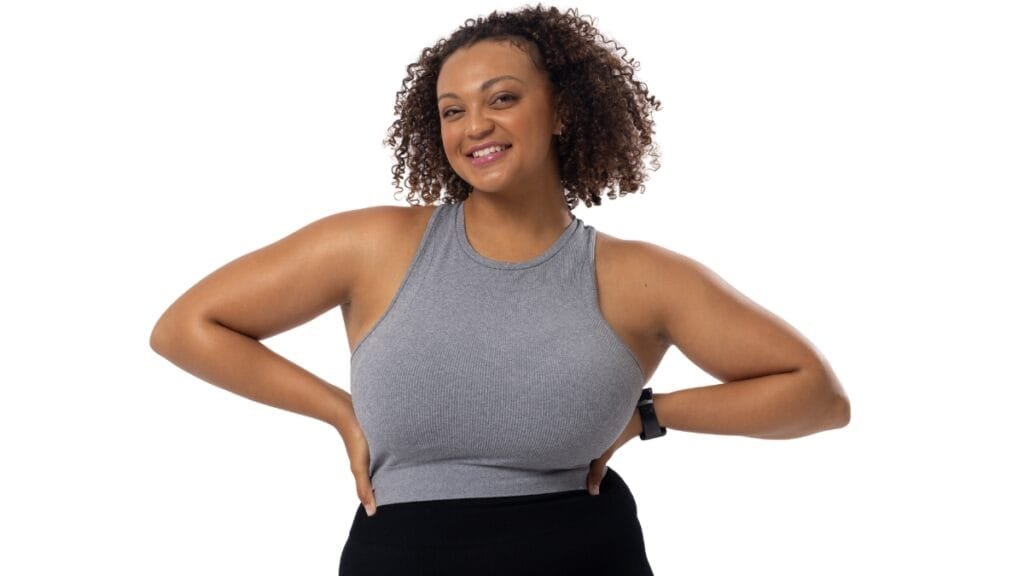 Full figured woman wearing a grey exercise bra for optimal support