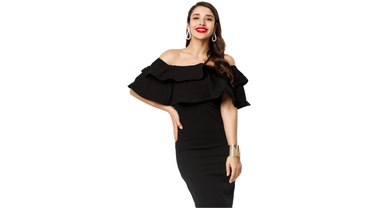 Plus size woman wearing an off-shoulder black dress with ruffle detailing and bold red lipstick.