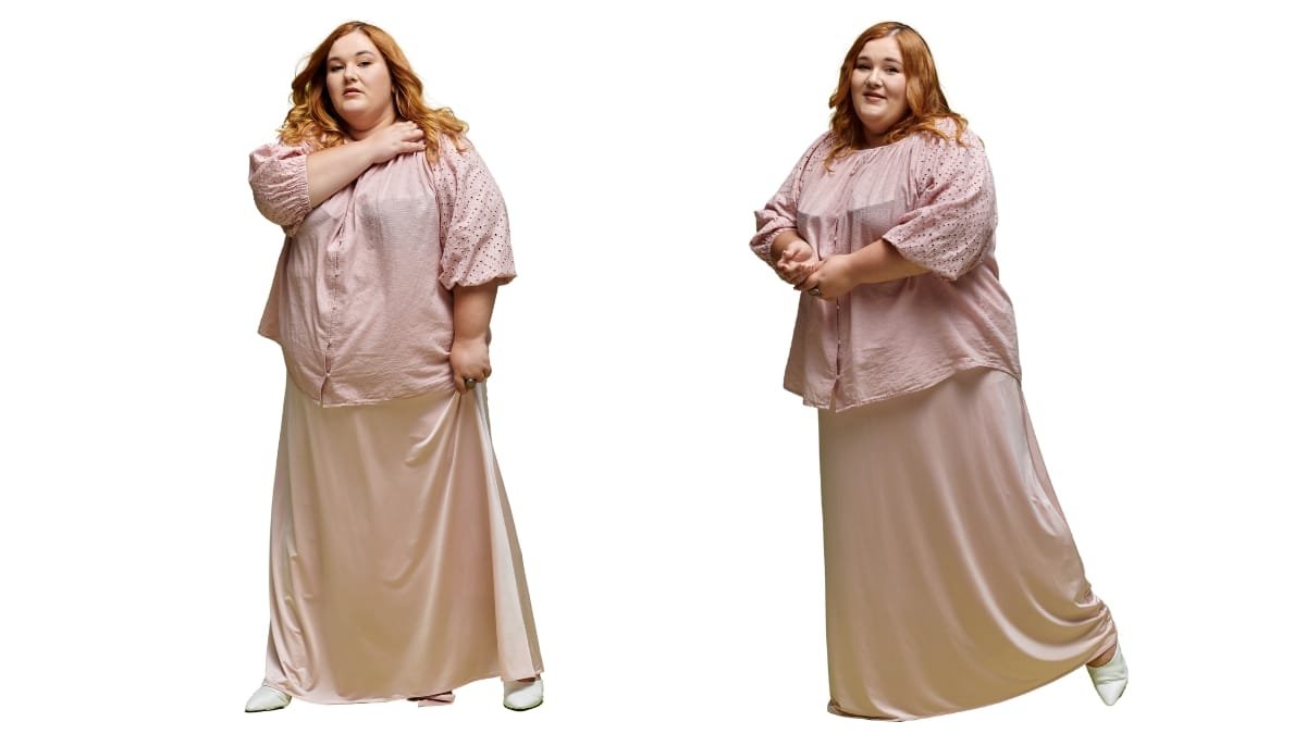 Plus satin dress in a soft blush pink color, featuring a loose-fitting top with short sleeves and a long skirt, worn by a curvy model.