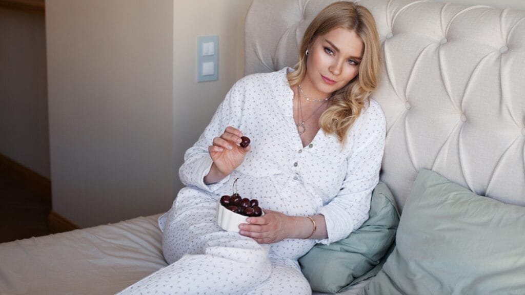 Plus size woman lounging in cotton pajamas, enjoying a snack