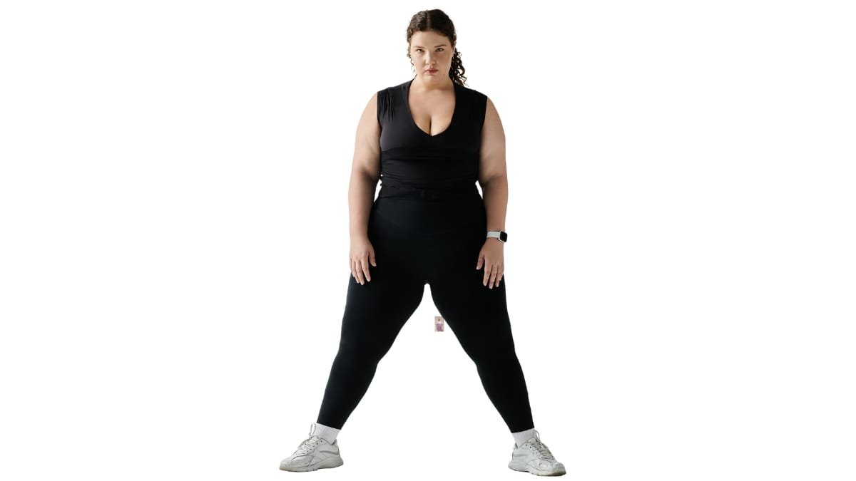 Woman confidently posing in womens plus size joggers, showing comfort and style